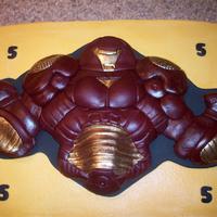 Iron Man Hulkbuster Cake Sheet cake iced in buttercream with fondant decorations and border.