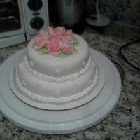 My First Tiered Cake This is my first time working with fondant. I made this cake for my Wilton Class III. After I finished the cake I realized I forgot to...