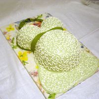 Kate's Cornelli Lace Bump Cake WASC belly cake. Raspberry SMBC filing in breasts, Lemon Curd in tummy. SMBC under MMF. Cornelli lace piped with royal icing. My first...