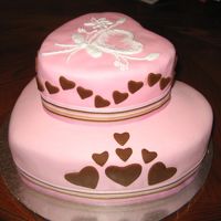 Hearts All Around The cake is out of mmf. This was my first stacked cake. The ribbon was my inspiration. Thanks for looking!