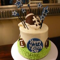 Dallas Cowboys Father's Day Cake Bottom tier is french vanilla w/ buttercream "grass". Second tier is chocolate with buttercream. Football is rice krispy treats...