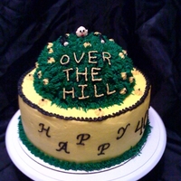 Over The Hill Top of the cake is chocolate and bottom half is classic white with strawberry filling. All buttercream frosting on cake.