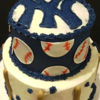 My Dad's Yankee Birthday Cake The bottom is a dummy with white buttercream and gumpaste bats. The top is a chocolate cake with navy buttercream and fondant baseballs....