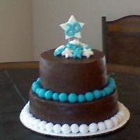 First Tiered Birthday Cake this was the first time i've done a real tiered cake. it's a yellow doctored cake mix with rasberry filling covered in a milk...