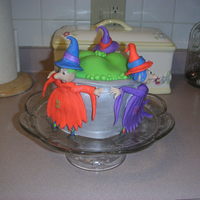 Witches I created this cake for my duaghter's 11th birthday which was on Halloween. I used Debbie Brown's cake to make mine.