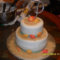 Beach Themed Wedding Cake Seashells are made of fondant and the sand is graham cracker crumbs. TFL!
