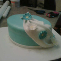 Oval Cake W/drape And Daisies Made this cake for my step-father's mother. I also made a sheet cake for everyone else to eat but wasn't able to get a picture...