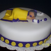 Baby Shower Cake I made this cake for one of my co-workers. This was my first fondant figurine and it came out better than expected.The cake is an 8"...