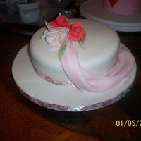 Fondant Drape And Fantasy Flower I actually started this cake in class and finished once I was home. I absolutely love the drape and used it with several other cakes since...