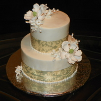 Summer Wedding WASC with Mimosa Filling . Gumpaste Magnolias and Fabric ribbom