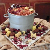 Crawfish Anyone 4 12" stacked layers of Chocolate fudge cake filled with Raspberry.Iced in Ganache then covered in Fondant. All of the accent pieces...