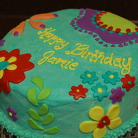 Spring Flowers Birthday Cake Cake is frosted in buttercream (poorly!) with fondant decorations. Most flowers were free-hand, but I used a cutter for the smallest ones....