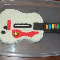 Guitar Hero Cake I made this kinda-ugly cake for my brother's birthday (hey, guys don't care what it looks like as long as it's tasty, right...