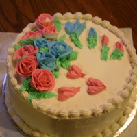 My 4Th Cake Well when i made this cake, my husband said it looked like a store boought cake until i put the rose buds on and the hearts LOL