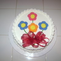 Flower Bouquet 9" 1 layer butter pecan cake with coconut pecan icing added to the mix and extra pecans. Buttercream icing.