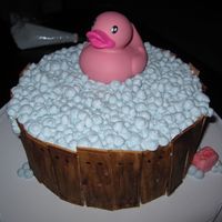 Ducky Bathtub Cake Sides are fondant, bubbles are store bought icing. Topped the bubbles with cake glitter to make it shine. A really fun cake to make!