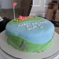 Dad's Birthday Cake Ideas taken from different cakes on the website. Decorations are fondant and icing, except the flag on the top of the cake.