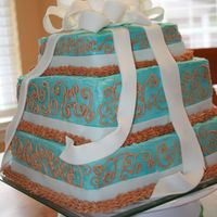 Cake With Bow This is one of my first cakes. It is buttercream icing with fondant bow and ribbon trim.