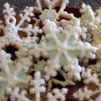Snowflake Christmas Cookies These are butter cookies and gingerbread cookies iced in royal icing and sprinkled with crystal sanding sugar.