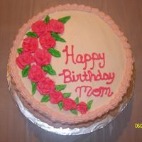 111.jpg First time making roses for a cake. They are made from buttercream frosting.