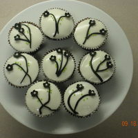 Black And White Cherry Blossom Cupcakes Chocolate cupcakes with coconut cream cheese frosting and gumpaste flowers
