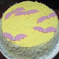 Going Batty On Halloween! Covered in buttercream with coconut on the sides, and fondant bats on top.