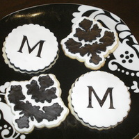 Black And White Damask/monogram Cookies NFSC with white Satin Ice and Black Fondarific. I cut the cookies and the fondant with my Cricut Cake and Martha Stewarts Elegant Cake Art...