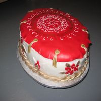 Indian Bridal Shower White cake, rasberry cream filling, covered with fondant and royal icing accents. First time using edible gold powder, and it's...