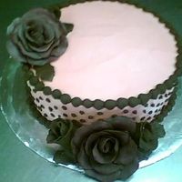 L_D250425C224F753C45E7Ca4D7435.jpg just a cake i made at school for fun. Chocolate cake with raspberry flavored buttercream, chocolate fudge icing, and modeling chocolate...