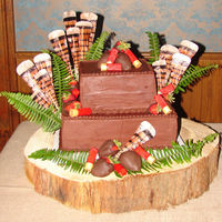 Turkey Hunter's Groom Cake This square chocolate butter cream cake is adorned with hand make rice paper tukey feathers and gum paste shotgun shells. People kept...