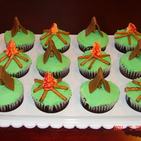 Gone Camping Cupcakes These chocolate cupcakes are iced in BC. I used MMF for the tents and simple stick pretzels for the camp fire logs. Red striping on a bag...