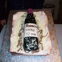 Wine Bottle Cake First time trying a wine bottle. I tried the method of using tin foil to make a pan. It did not work well. Next time I will try something...