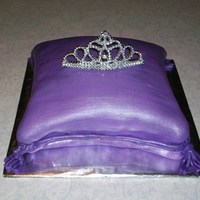 Pillow Red velvet cake with cream cheese filling. Covered in MMF. I had made a tiara out of RI but when I went to put it on the cake it shattered...