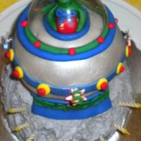 Spaceship Alien Cake My 8 yr old son wanted a spaceship with an alien landing on the moon cake. :)