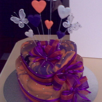Two Tier Heart Wedding Cake Two Tier Heart Wedding Cake.Colour Scheme - Orange, Purple and a touch of Black.I made marble fondant with orange, purple and a touch of...