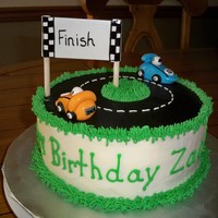 Race Care Cake 8 inch round buttercream. Road made of fondant. Cars fondant and gumpaste