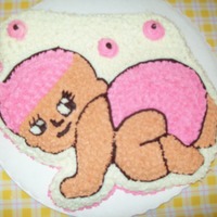 Pink Baby With Bonnet Baby cake pan covered in buttercream.