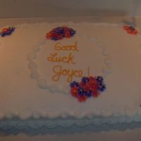 Women's Retirement This is a basic sheet cake iced in buttercream with buttercream swirled flowers.