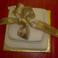 Individual Cakes For Reception Tables I made 25 of these two-tier cakes for each table at the reception. Iced in buttercream with a simple border and topped with a fabric ribbon...