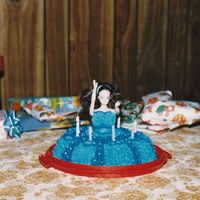 Melissa And Melody's 5Th And 3Rd Birthday Cake A blue birthday cake that I made with a doll and a bundt cake. I didn't have the wonderpan at this point. I didn't have much of...