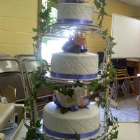 Lyssa's Wedding Cake All buttercream with ribbon border and edible pearl beads. Silk flowers on each tier. This was my first solo wedding cake!!