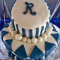 Reavis High This is a fun graduation cake. It was a 3 tier but the bottom tier had an unfortunate ride on top of the washer...cake + spin cycle =...