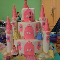 Princess Castle Cake This is the Princess Castle Cake my niece and I did for a little girls birthday party. The turants are fondant covered rice crispy treats...