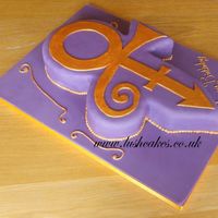 Prince Love Symbol Made for a customer who is a big fan! Cake was carved from an 8" round and a 10" x 12" pan. Gold details were handpainted.