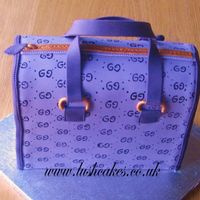 Gucci Bag Yummy chocolate cake disguised as a Gucci bag! The 'G's were handpainted. Cake was carved from a 12" x 10" cake.