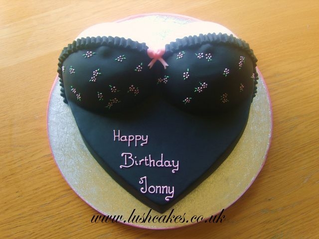 Bustier Cake This was my OH's birthday cake. I made it from a 12" heart tin and the wilton soccer ball tin and carved the sides of the heart...