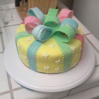 P_00303.jpg this was my 2nd fondant cake . i tried to do the wilton bow cake for a friends bithday .