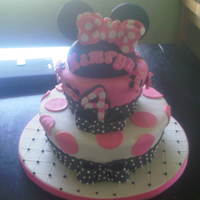 Minni Mouse Cake A customer saw another Minni Mouse Cake I did and she loved it! So we changed the design around a bit. Both layers are chocolate cake with...