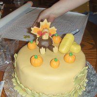 Thanksgiving Turkey Cake 8 inch round red velvet cake with fondant covering and fondant decorations. Inspiration came from CC member but I don't remember name...