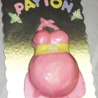 Daisy Belly Cake White cake filled with milk chocolate ganache, frosted in mock bettercream, and covered in MMF. Thanks for looking!